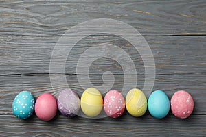 Multicolor Easter eggs on grey background, space for text