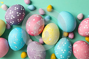 Multicolor Easter eggs on mint background