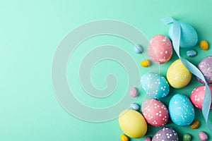 Multicolor Easter eggs and ribbon on background, space for text