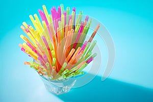 Multicolor flexible straws in the glass closeup