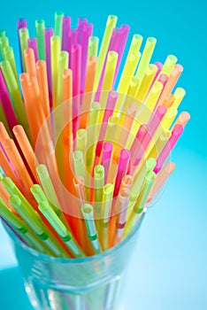 Multicolor flexible straws in the glass closeup