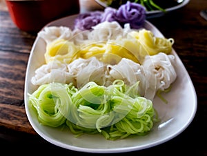 Multicolor Khanom chinThaiâ€“riceâ€“flour noodles in the plate.