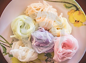 Multicolor Khanom chinThaiÃ¢â‚¬â€œriceÃ¢â‚¬â€œflour noodles in the plate.