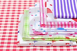 Multicolor napkin on checkered fabric
