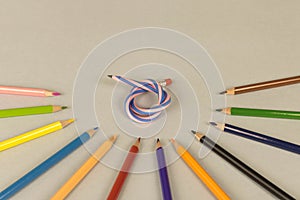 Multicolor pencils and flexible pencil on a light background. Close up. Selective focus