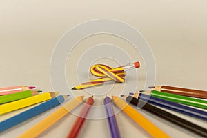 Multicolor pencils and flexible pencil on a light background. Close up. Selective focus