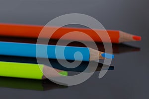 Color pencils on black background