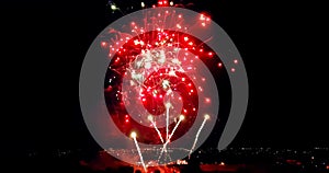 Multicolor real abstract blinking sparkle celebration fireworks lights on black background, festive happy new year