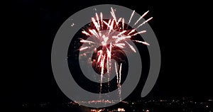 Multicolor real abstract blinking sparkle celebration fireworks lights on black background, festive happy new year