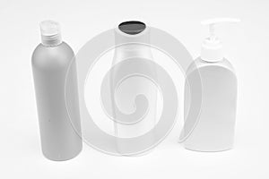 Multicolor refillable flip cap and pump cosmetic product packaging in row, bottles