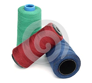 Multicolor sewing thread isolated on white background.