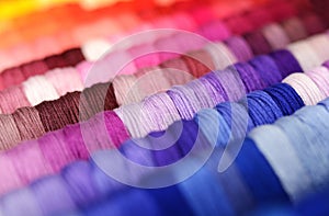 Multicolor sewing threads background