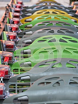 Multicolor shopping carts outside of shopping mall close up slective focus