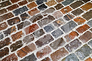 Multicolor stone paving in snow