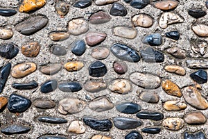 Multicolor stones decoration on concrete top view