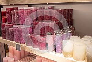 Multicolor store front or supermarket with decorative aromatic candles. Shopping, sale, consumerism and people concept