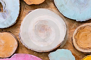 Multicolor wooden natural sawn logs as background
