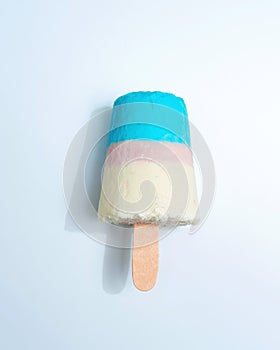 Multicolored appetizing ice cream lolly on a gray background with copy space. Top view