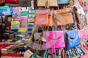 Multicolored bags and wallets on the market