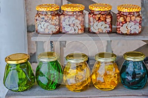 Multicolored banks with syrups of wild mountain plants and nuts.