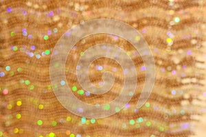 Multicolored bokeh on ripple wave horizontal pattern texture abstract backgroundgold,green,pink,blue,purple