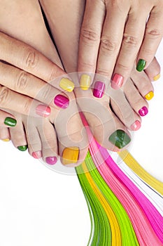 Multicolored bright manicure and pedicure