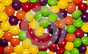 Multicolored candy drops in glaze.Chewy fruit candy background.