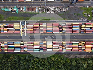 multicolored cargo containers in the port aerial photo on a summer day
