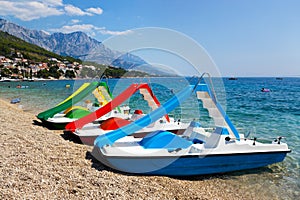 Multicolored catamaran on beach