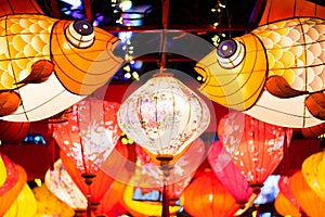 Multicolored Chinese lanterns illuminated at night