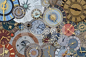 Multicolored collection of ancient church tower clocks on a pile