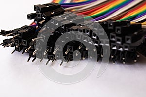 Multicolored computer wires on a white background