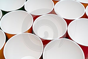 Multicolored disposable paper cups for drinks