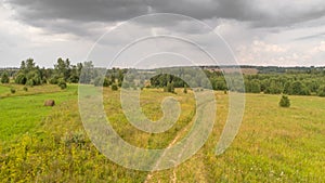 Multicolored European Countryside Spring Landscape With Green Field