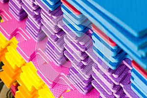 Multicolored EVA Foam puzzle mats stacked