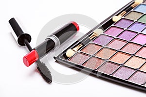 Multicolored eye shadows palette, red Lipstick and black mascara