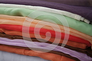 Multicolored fabric. Pile colored textiles.