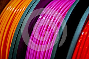 Multicolored filaments of plastic for printing on 3D printer close-up