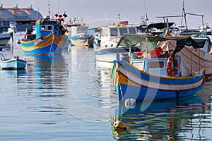 Marsaxlokk. Traditional boats Luzzu in the old harbor. photo