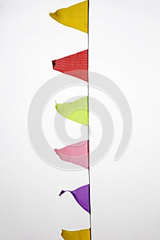 Multicolored flags against sky