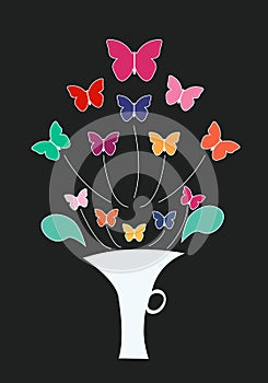 Multicolored flowers are butterflies in a white vase with a black background