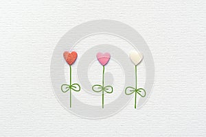 Multicolored Flowers in Heart Shape Made of Sugar Candy Sprinkles Hand Drawn Steams Leaves on White Watercolor Paper