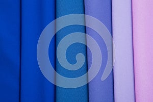 Multicolored folds of blue, lilac and pink fabric