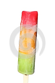 Multicolored frozen ice on a wooden stick isolated on a white background. Delicious ice cream red, orange, green colors