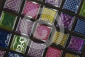 Multicolored glass stained glass blocks on exhibition stand