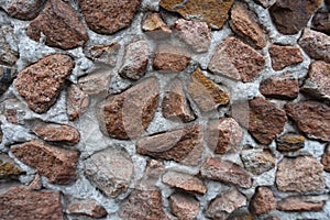 Multicolored gravel pebble dash on the wall