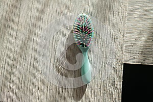 Multicolored hair comb. Hair loss on a plastic comb. Hair loss problem. Plastic hair brush