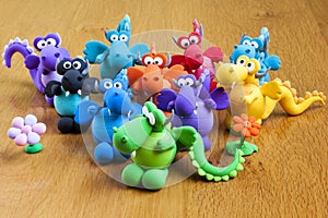 Multicolored handmade modelling clay dragons