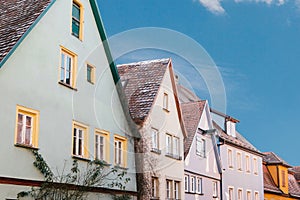 Multicolored houses with many windows in Rothenburg ob der Tauber in Germany.