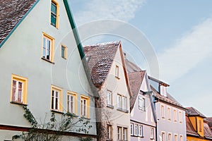 Multicolored houses with many windows in Rothenburg ob der Tauber in Germany.